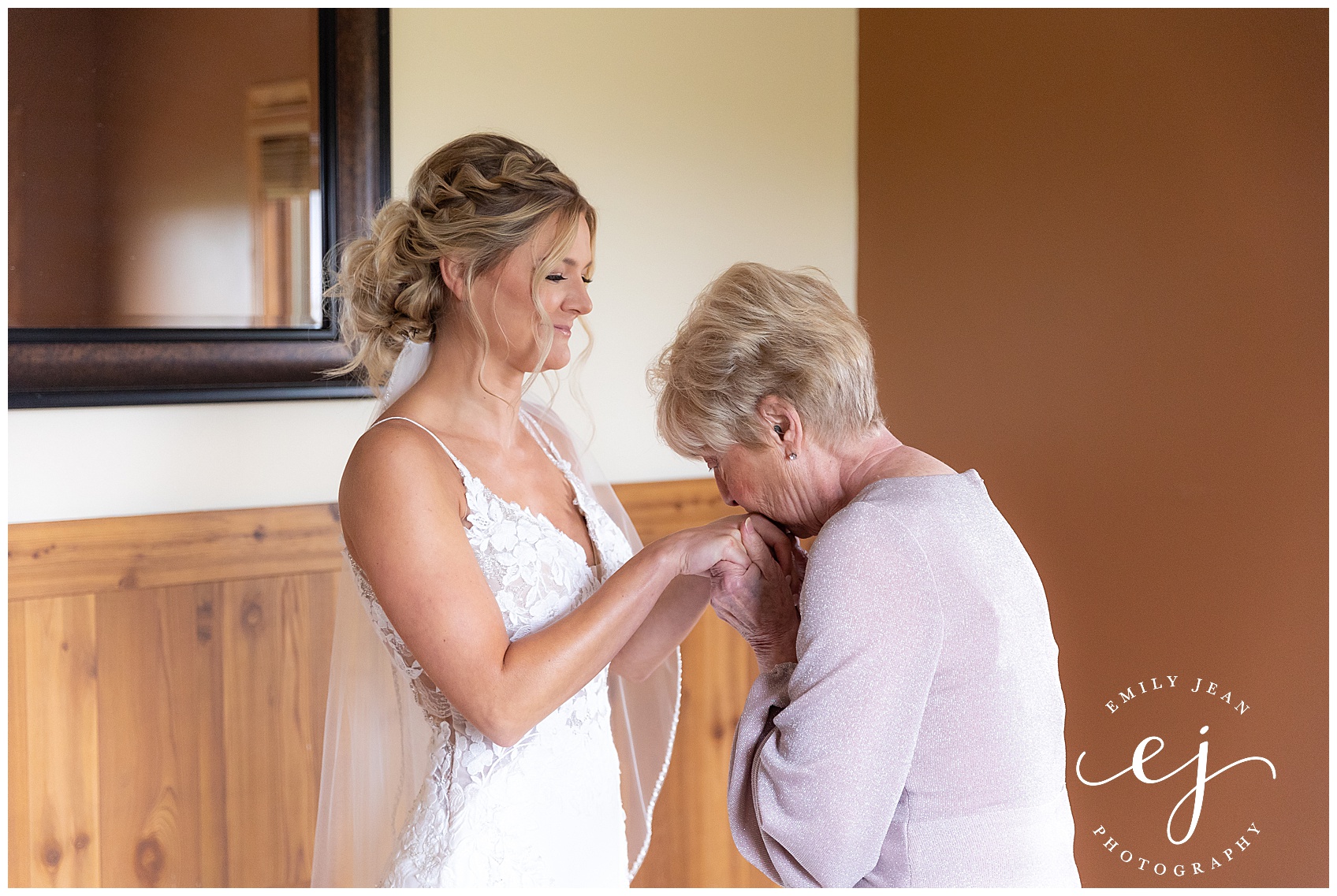 grandma kissing hands of bride