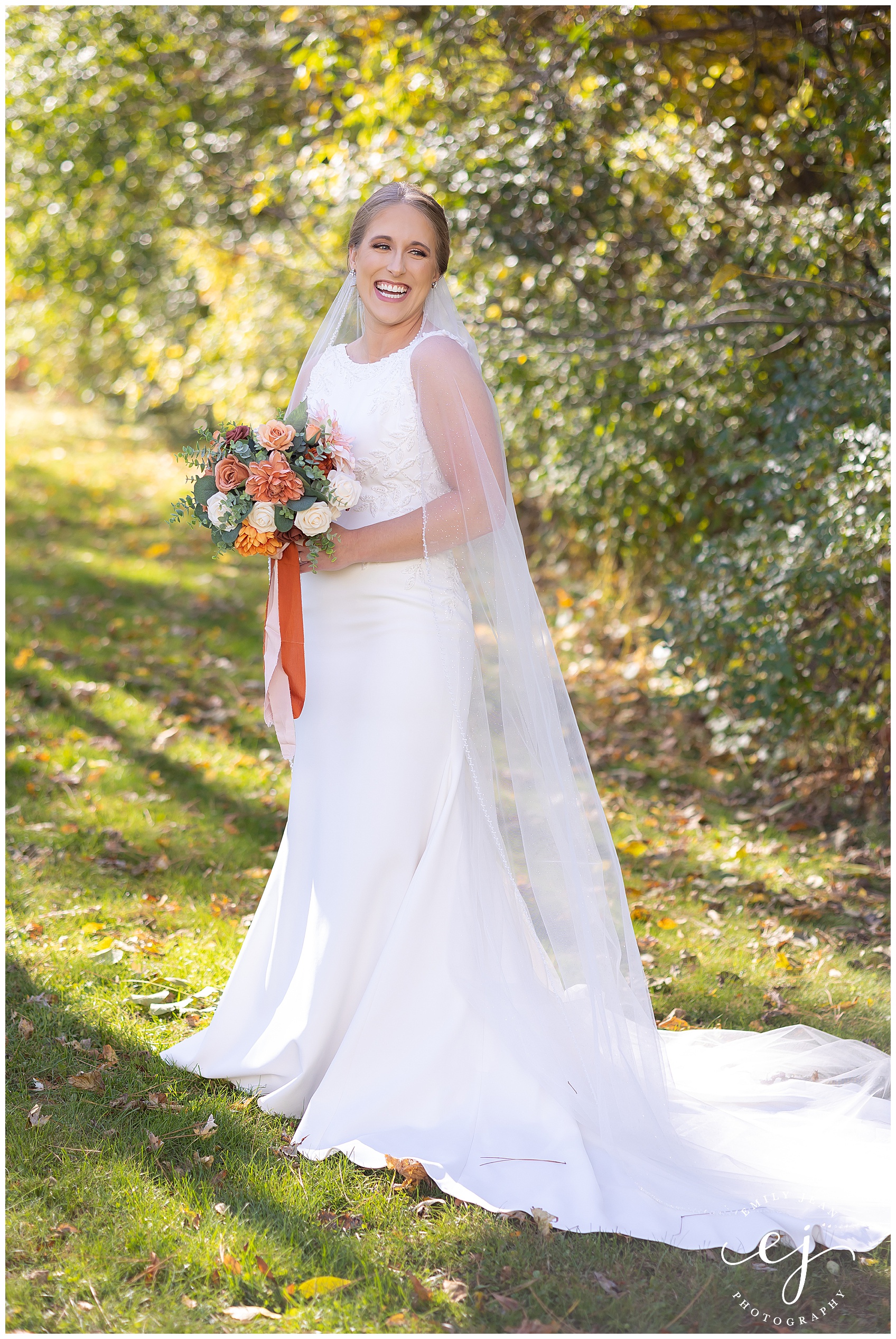 bride smiling at camera full lenght portrait