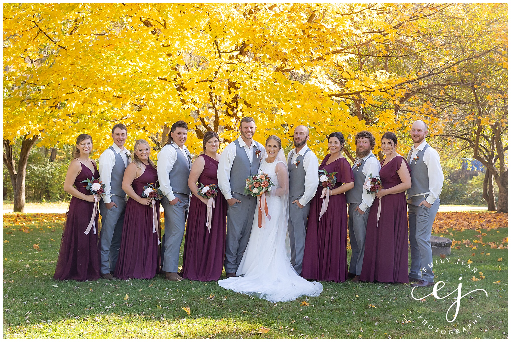 bridal wedding party with mean and women in grey and burgundy