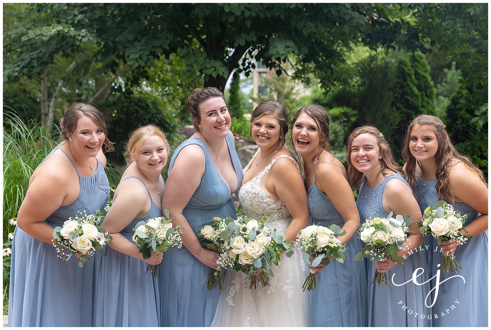 bridesmaids at riverside park wearing light blue dresses