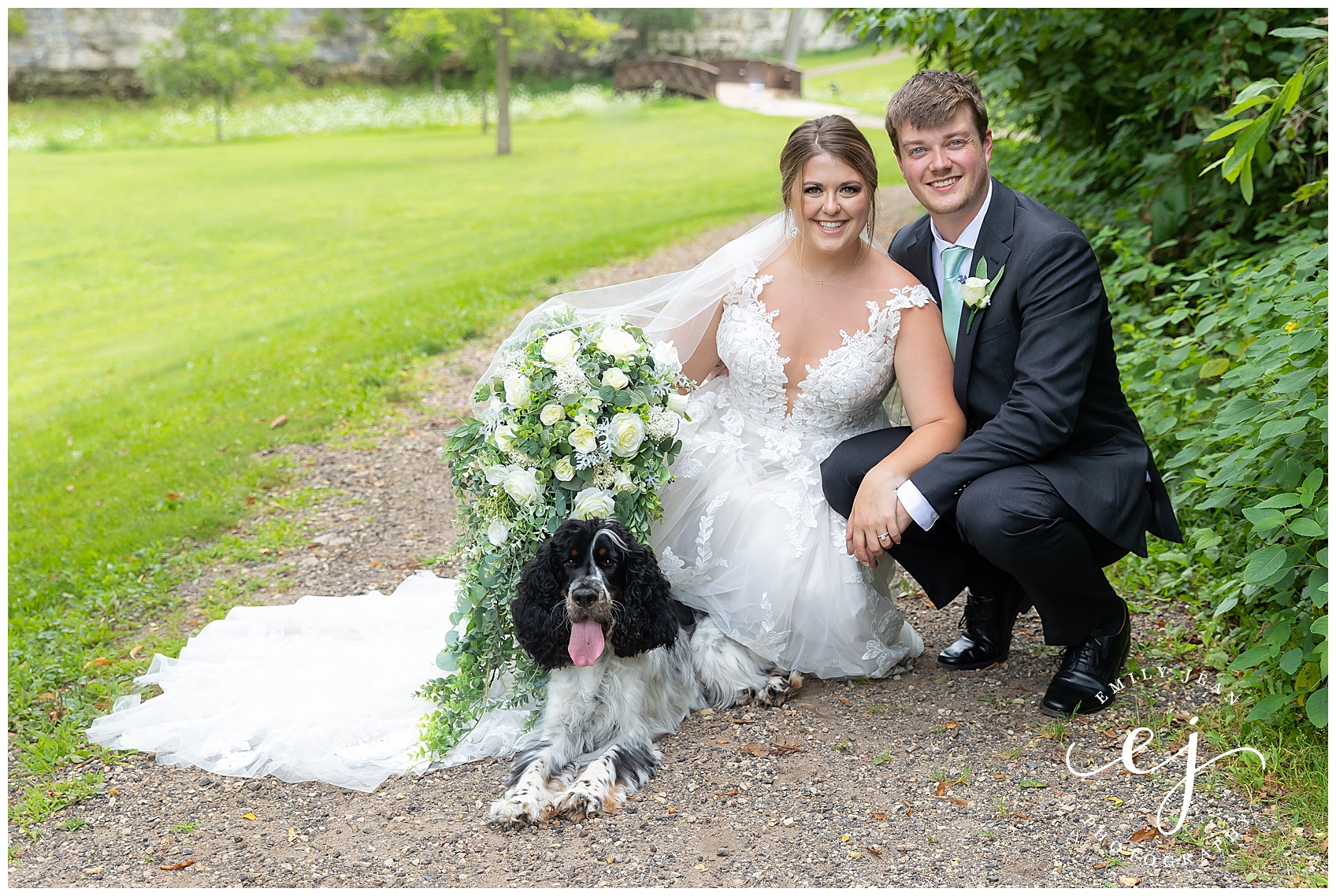 bride and groom with fluffy dog 