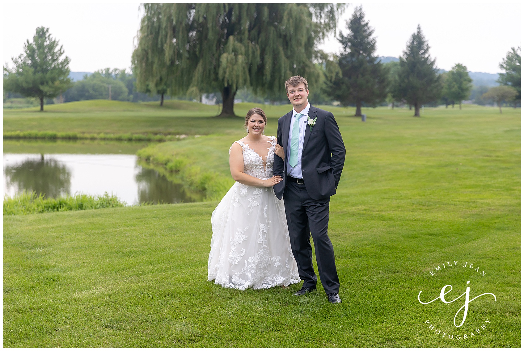 bride and groom smiling standing on golf course
