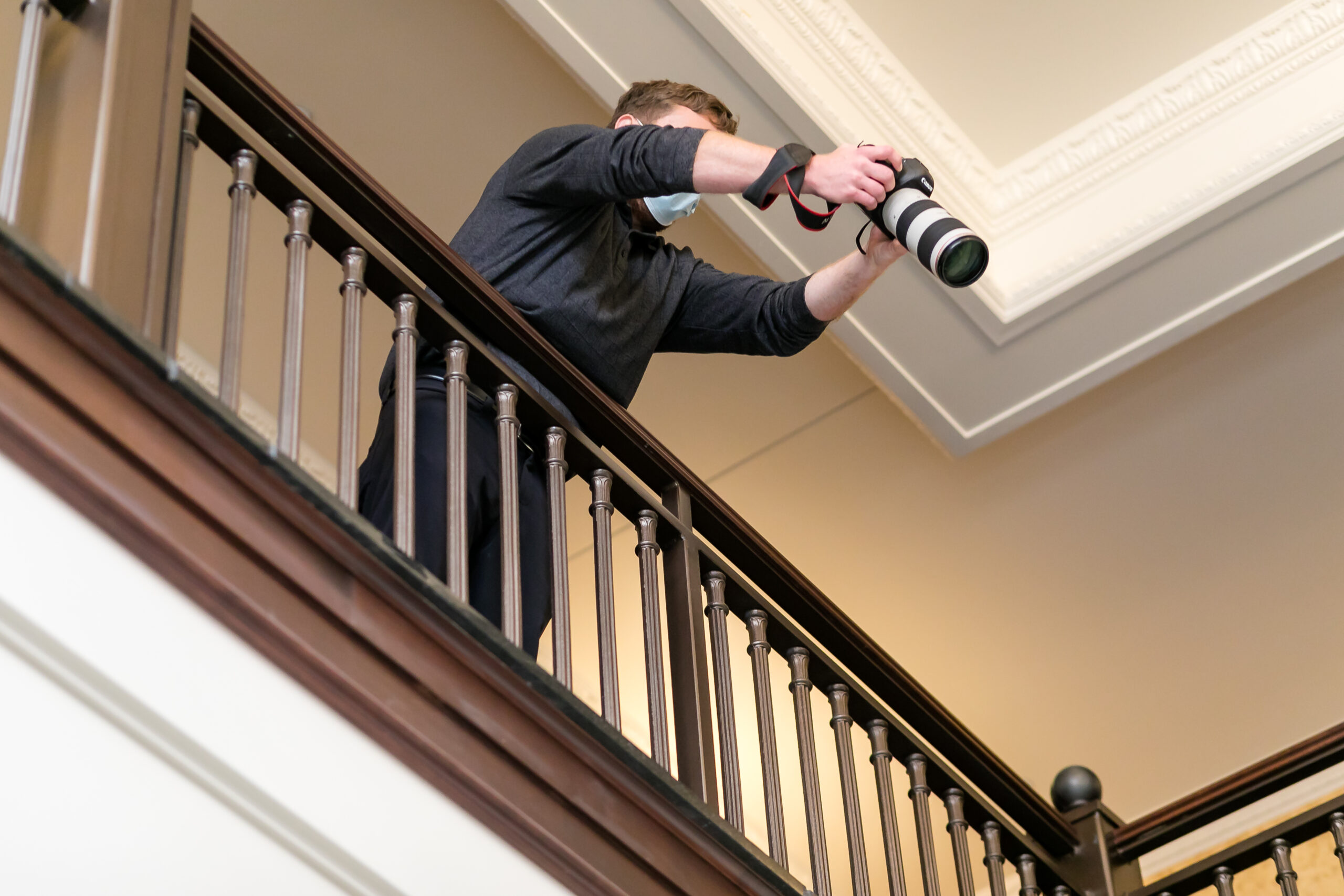 ben branson at the cargill room getting a second angle of a bride and groom from the balcony