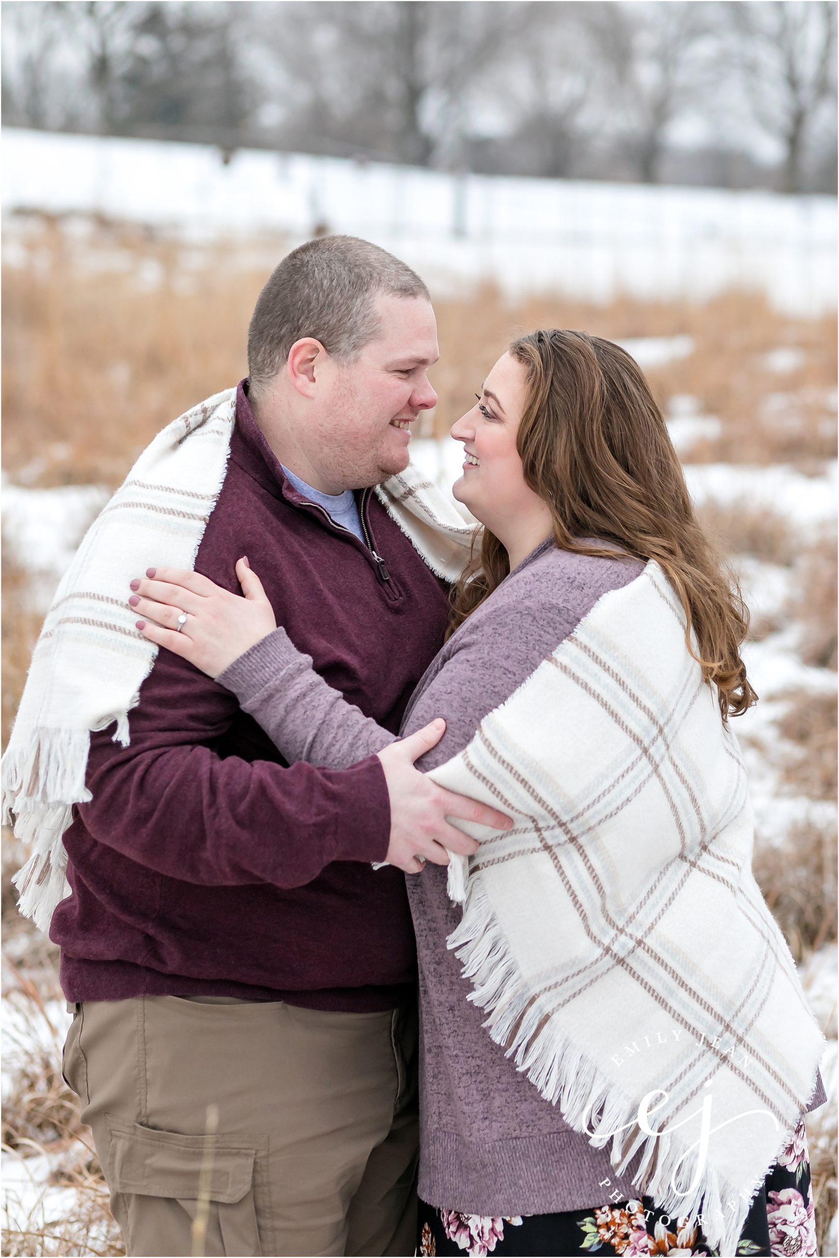 wisconsin engagement session photo couple facing each other with blanket
