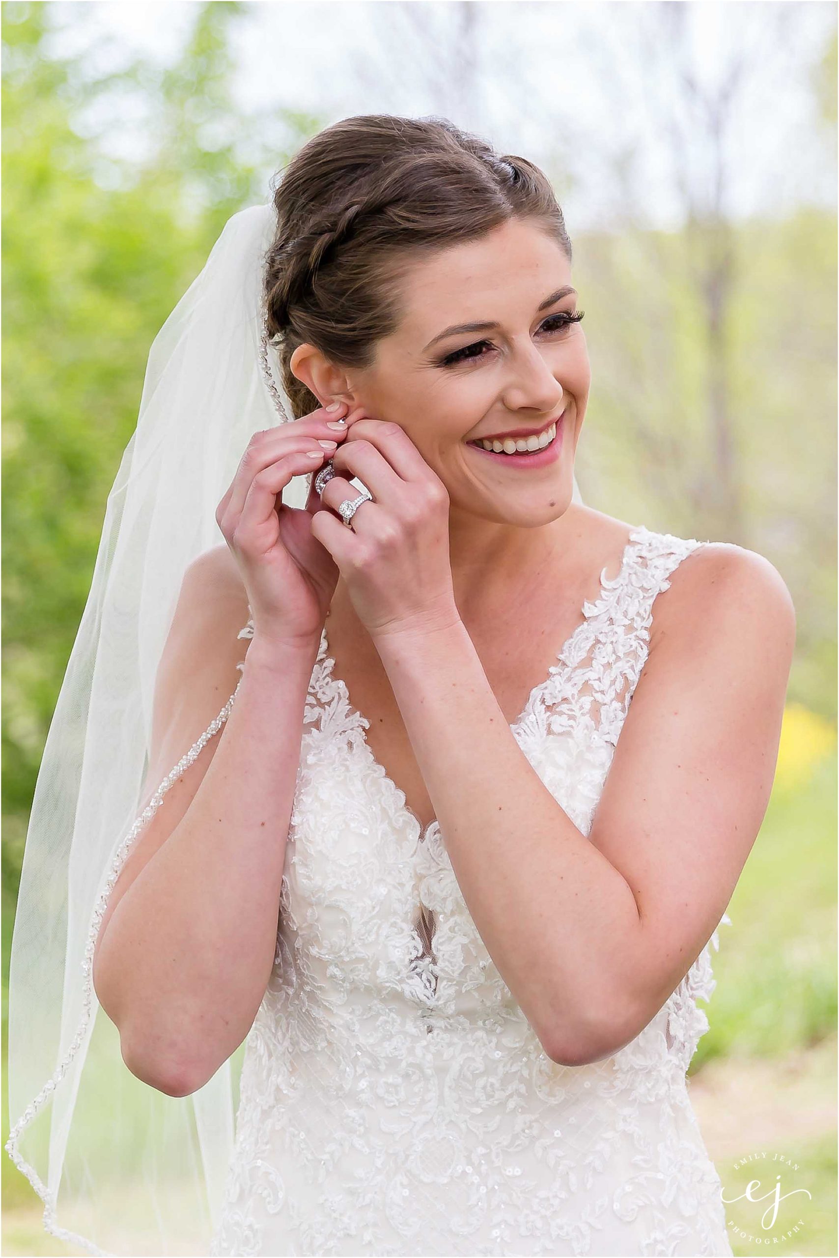 bride putting her earrings in outside at stoney creek