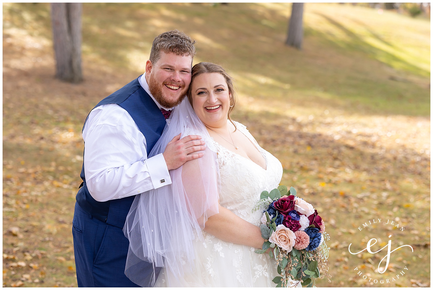 plus size bride and groom portraits autumn wedding at Myrick Park La Crosse Wisconsin burgundy and navy wedding
