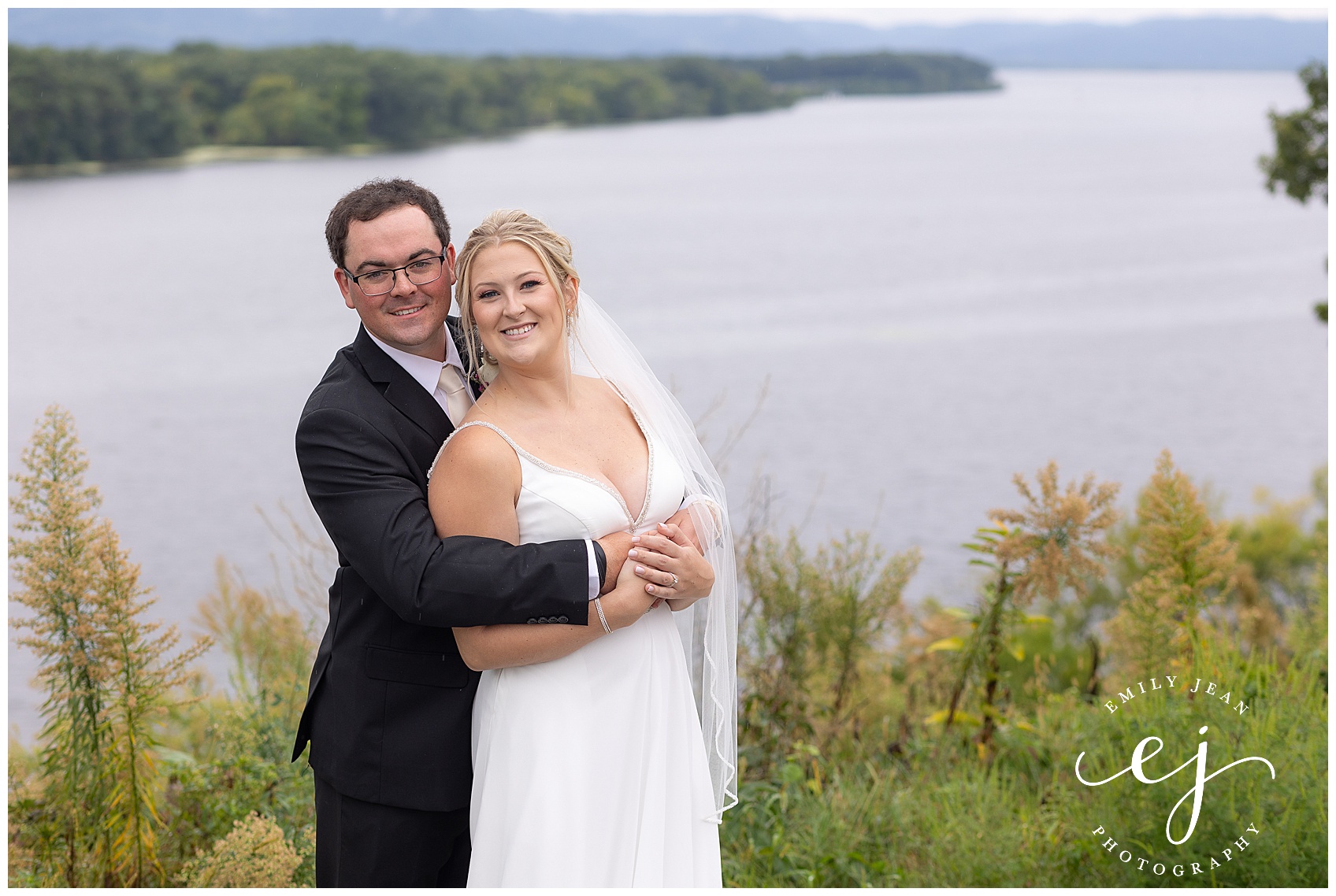 bride and groom smiling portrait outside lake onalaska