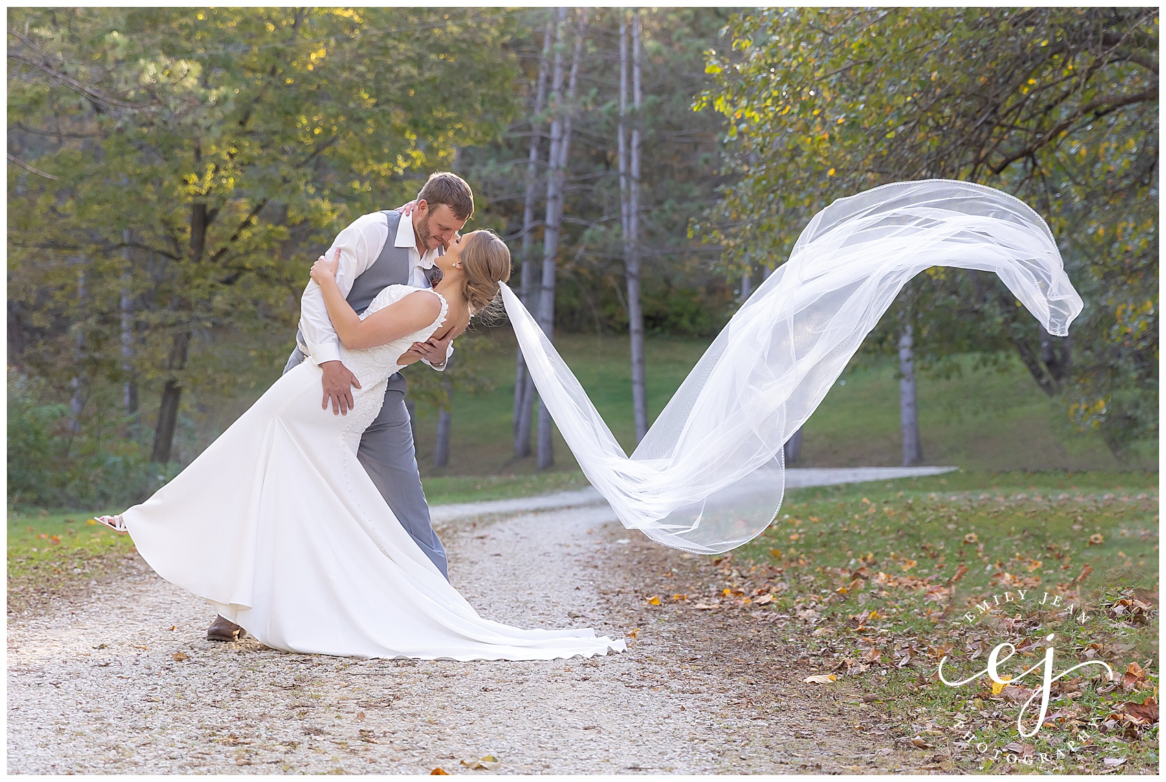groom dipping bride simple long white veil